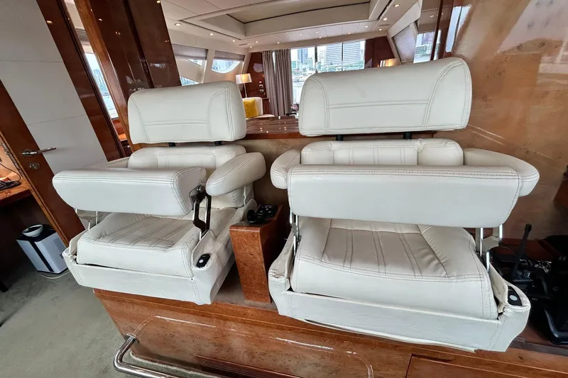 Sunshine Yacht Photos Pics Luxurious interior of 2010 Versilcraft Euroyacht Planet 125S with plush white seating.