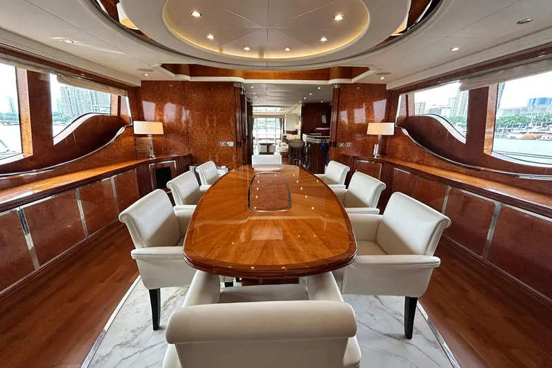 Sunshine Yacht Photos Pics Luxurious interior of 2010 Versilcraft Euroyacht Planet 125S Hardtop with elegant dining area.