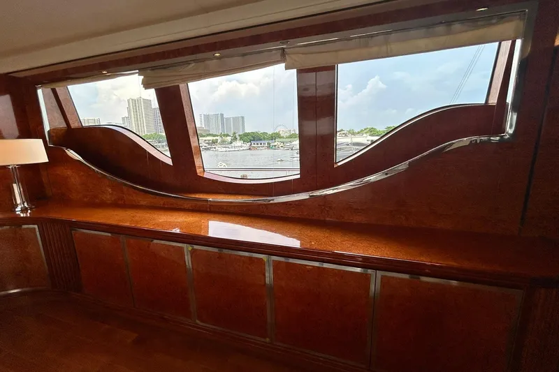 Sunshine Yacht Photos Pics Luxurious interior of 2010 Versilcraft Euroyacht Planet 125S with elegant wood finish and scenic window view.