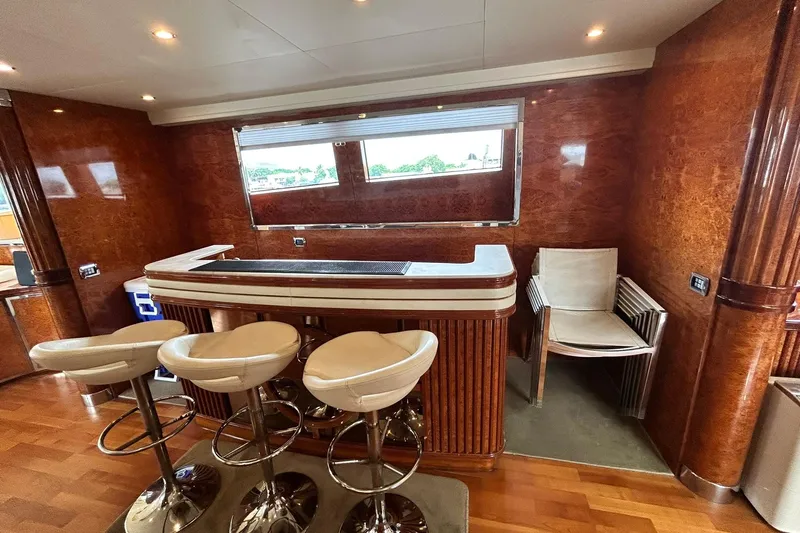 Sunshine Yacht Photos Pics Luxurious interior of 2010 Versilcraft Euroyacht Planet 125S with elegant bar and seating.