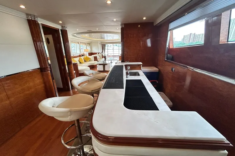 Sunshine Yacht Photos Pics Luxurious interior of 2010 Versilcraft Euroyacht Planet 125S Hardtop with elegant bar and seating.