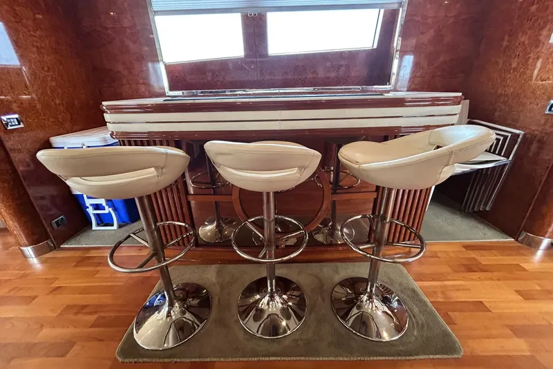 Sunshine Yacht Photos Pics Luxurious bar area with stools on Versilcraft Euroyacht Planet 125S Hardtop, 2010 model.