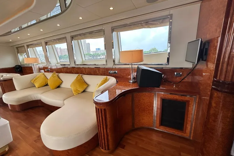 Sunshine Yacht Photos Pics Luxurious interior of 2010 Versilcraft Euroyacht Planet 125S with elegant seating and wood finishes.