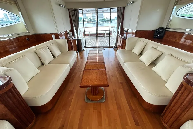 Sunshine Yacht Photos Pics Luxurious interior of 2010 Versilcraft Euroyacht Planet 125S with elegant seating and wood finishes.