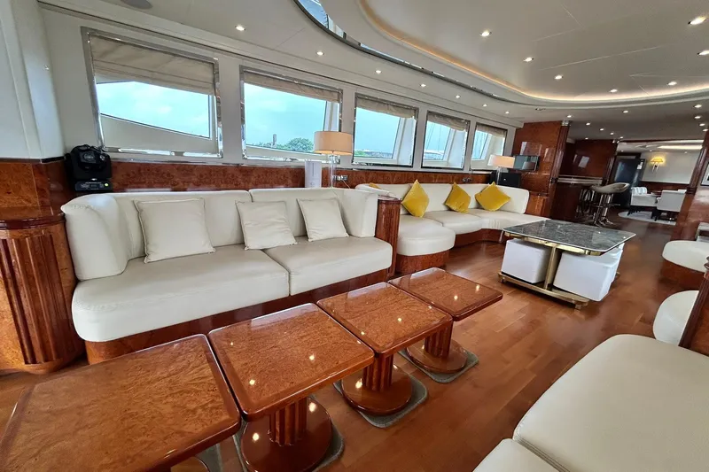 Sunshine Yacht Photos Pics Luxurious interior of 2010 Versilcraft Euroyacht Planet 125S Hardtop with elegant seating and wooden accents.