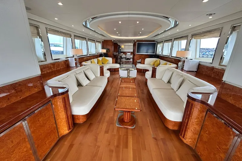 Sunshine Yacht Photos Pics Luxurious interior of 2010 Versilcraft Euroyacht Planet 125S Hardtop with elegant seating and wood finishes.