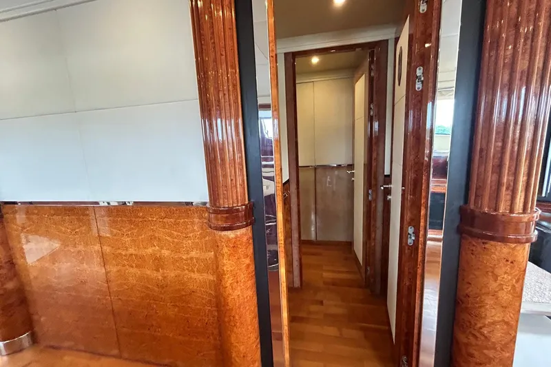 Sunshine Yacht Photos Pics Luxurious interior of 2010 Versilcraft Euroyacht Planet 125S with elegant wood finishes.