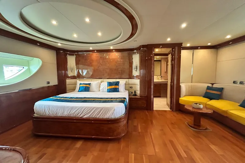 Sunshine Yacht Photos Pics Luxurious bedroom in 2010 Versilcraft Euroyacht Planet 125S Hardtop with elegant wood finishes.