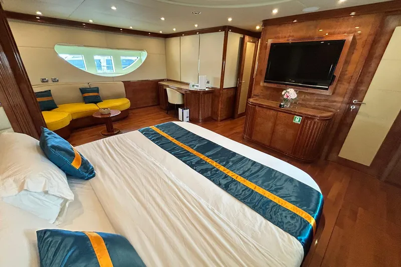 Sunshine Yacht Photos Pics Luxurious bedroom interior of 2010 Versilcraft Euroyacht Planet 125S Hardtop with elegant furnishings.