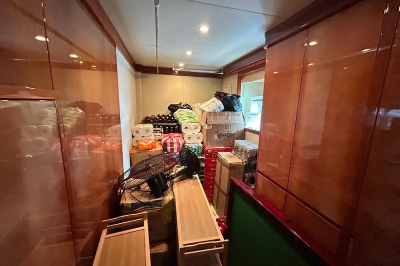 Sunshine Yacht Photos Pics Storage room on 2010 Versilcraft Euroyacht Planet 125S, filled with supplies and boxes.