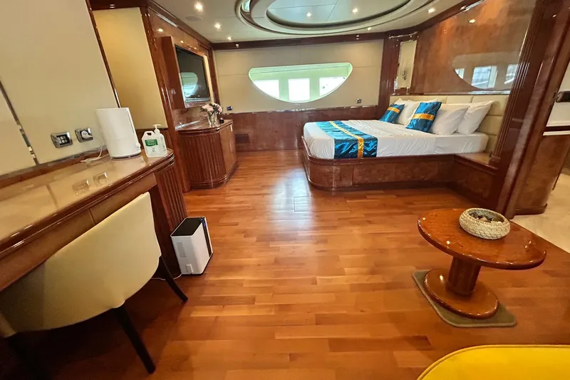 Sunshine Yacht Photos Pics Luxurious interior of 2010 Versilcraft Euroyacht Planet 125S with elegant wood finishes and modern amenities.