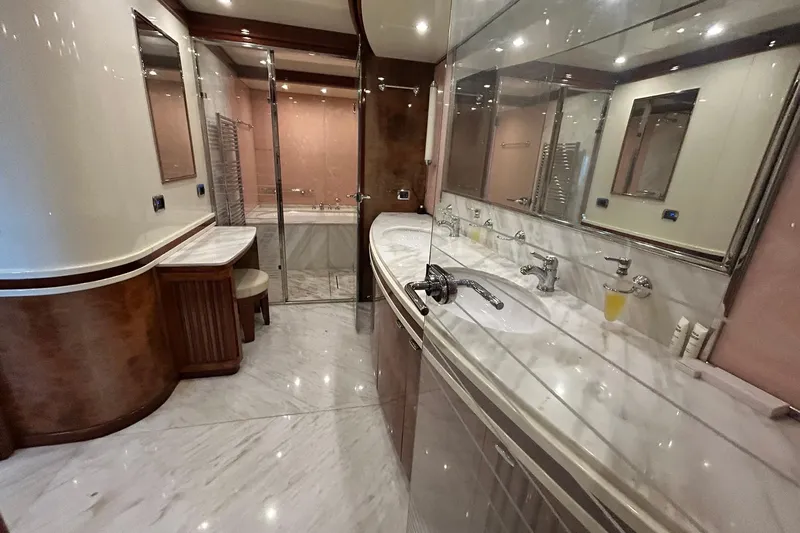 Sunshine Yacht Photos Pics Luxurious bathroom in 2010 Versilcraft Euroyacht Planet 125S, featuring marble countertops and elegant fixtures.