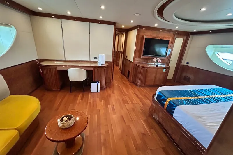 Sunshine Yacht Photos Pics Luxurious interior of 2010 Versilcraft Euroyacht Planet 125S Hardtop with elegant wood finishes.