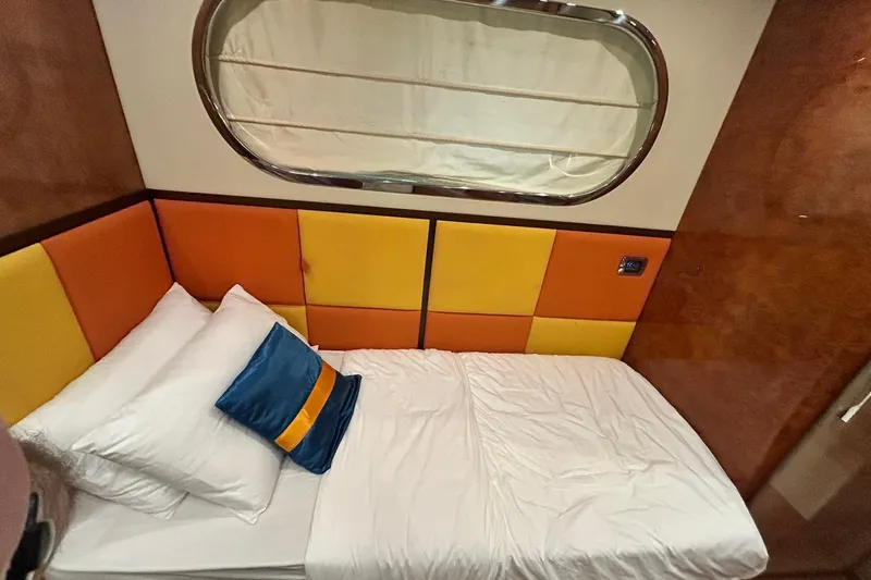 Sunshine Yacht Photos Pics Luxurious cabin interior of 2010 Versilcraft Euroyacht Planet 125S with colorful padded walls.