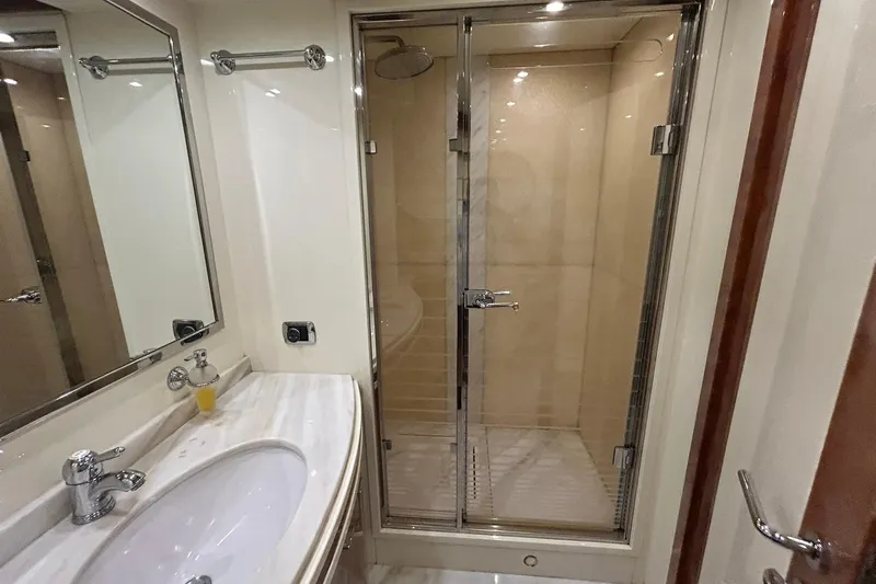 Sunshine Yacht Photos Pics Luxurious bathroom in 2010 Versilcraft Euroyacht Planet 125S Hardtop with glass shower.