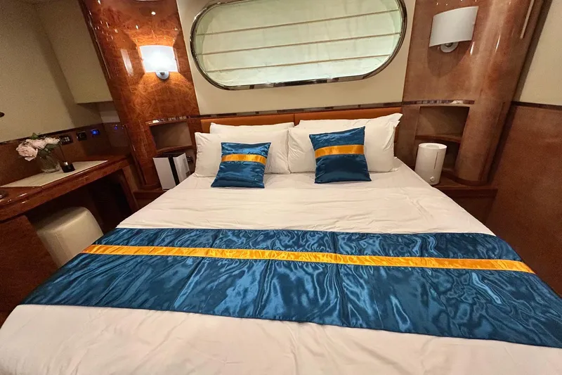 Sunshine Yacht Photos Pics Luxurious bedroom interior on 2010 Versilcraft Euroyacht Planet 125S Hardtop with elegant bedding.