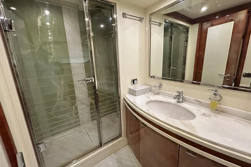 Sunshine Yacht Photos Pics Luxurious bathroom in 2010 Versilcraft Euroyacht Planet 125S, featuring elegant shower and marble sink.
