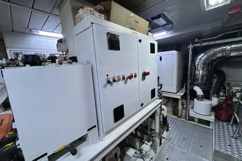 Sunshine Yacht Photos Pics Engine room of 2010 Versilcraft Euroyacht Planet 125S Hardtop with control panels and machinery.