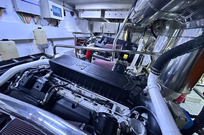 Sunshine Yacht Photos Pics Engine room of 2010 Versilcraft Euroyacht Planet 125S Hardtop, showcasing mechanical components.