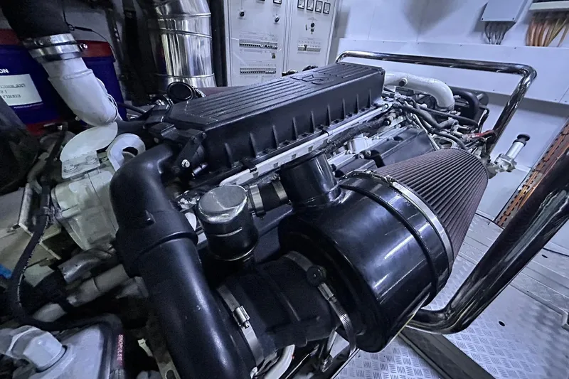 Sunshine Yacht Photos Pics Engine room of 2010 Versilcraft Euroyacht Planet 125S Hardtop, showcasing detailed machinery.