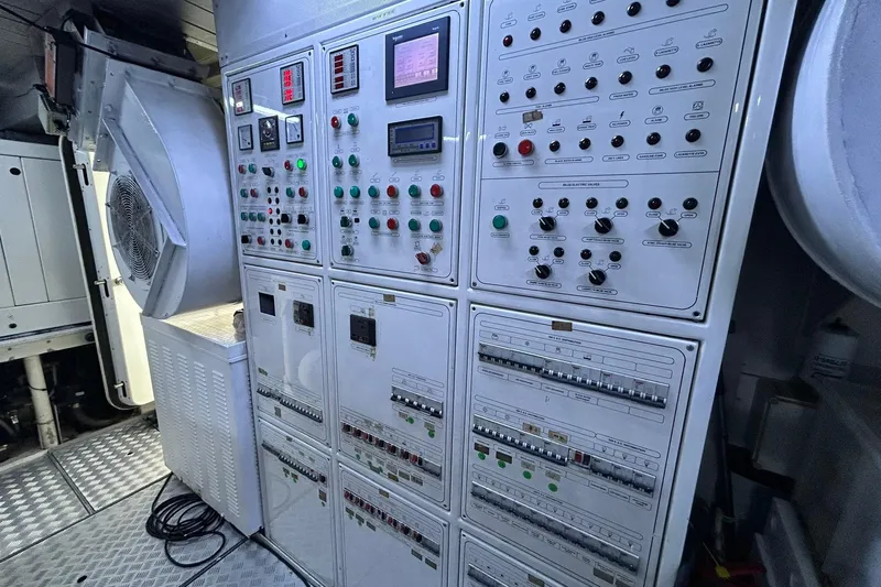 Sunshine Yacht Photos Pics Control panel inside 2010 Versilcraft Euroyacht Planet 125S Hardtop, featuring various switches and indicators.