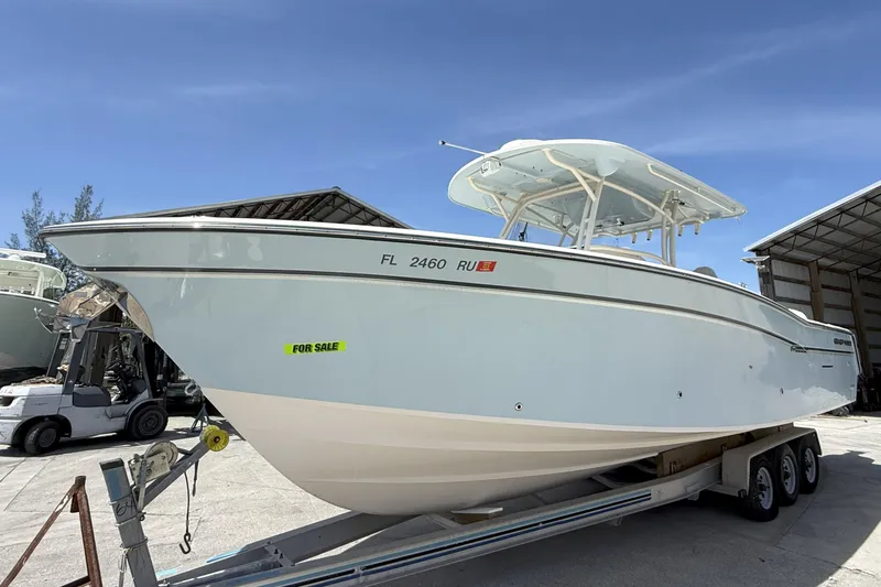 336-311 Brokerage Ron Yacht Photos Pics 2018 Grady-White Canyon 336 boat for sale on trailer, sunny day.