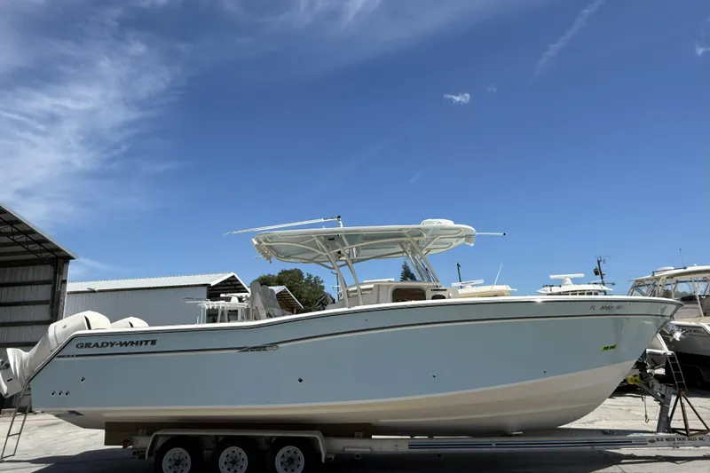 336-311 Brokerage Ron Yacht Photos Pics 2018 Grady-White Canyon 336 boat on trailer under clear blue sky.