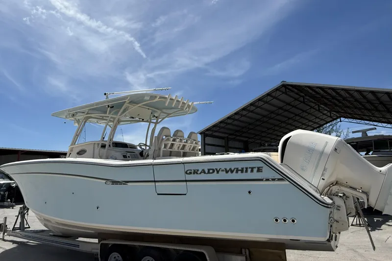 336-311 Brokerage Ron Yacht Photos Pics 2018 Grady-White Canyon 336 boat with Yamaha engines under a clear blue sky.