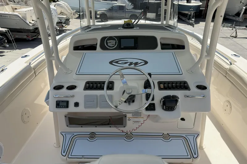 336-311 Brokerage Ron Yacht Photos Pics 2018 Grady-White Canyon 336 boat console with steering wheel and controls.