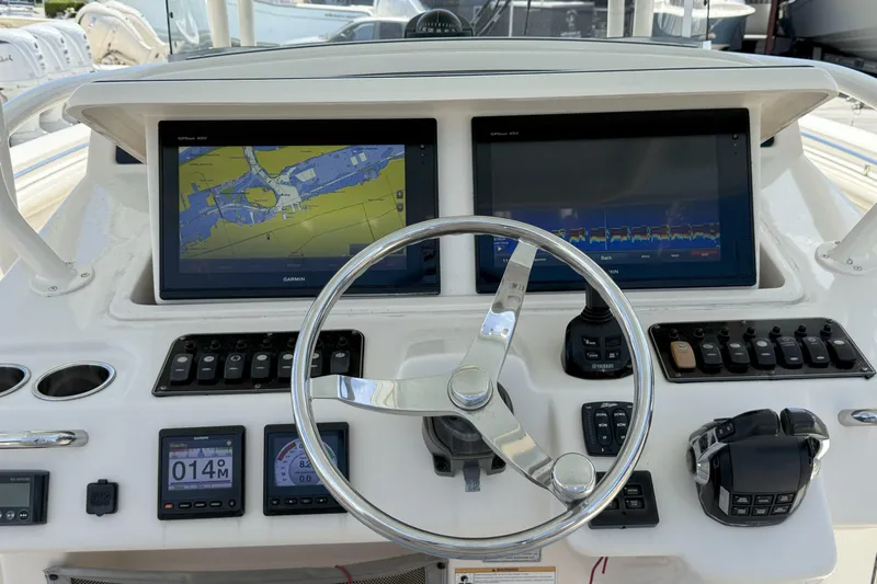 336-311 Brokerage Ron Yacht Photos Pics 2018 Grady-White Canyon 336 helm with dual Garmin displays and navigation controls.