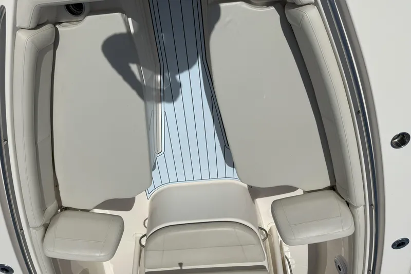 336-311 Brokerage Ron Yacht Photos Pics 2018 Grady-White Canyon 336 boat interior with cushioned seating and striped flooring.