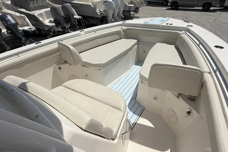 336-311 Brokerage Ron Yacht Photos Pics 2018 Grady-White Canyon 336 boat interior with cushioned seating and storage compartments.