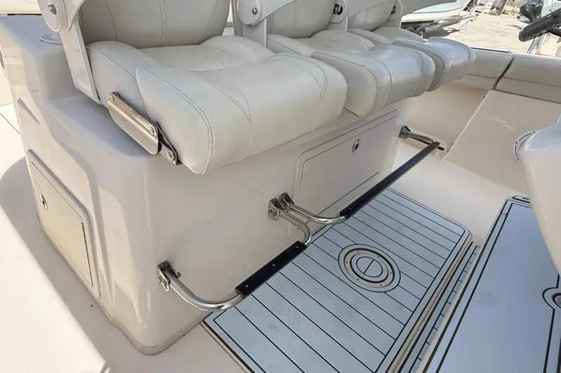 336-311 Brokerage Ron Yacht Photos Pics 2018 Grady-White Canyon 336 boat interior with white seating and storage compartments.