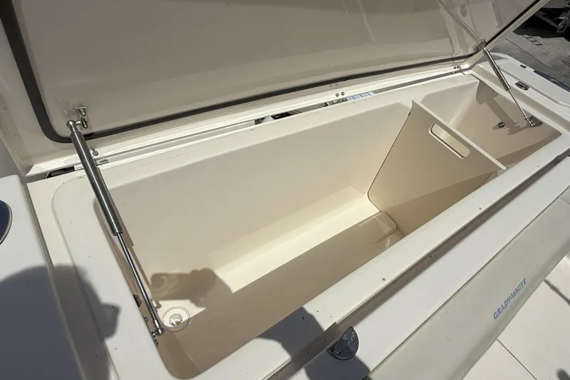 336-311 Brokerage Ron Yacht Photos Pics Open storage compartment on 2018 Grady-White Canyon 336 boat, showcasing spacious interior.