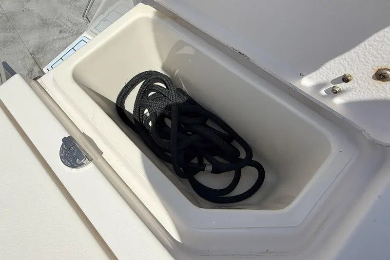 336-311 Brokerage Ron Yacht Photos Pics Storage compartment with rope on a 2018 Grady-White Canyon 336 boat.