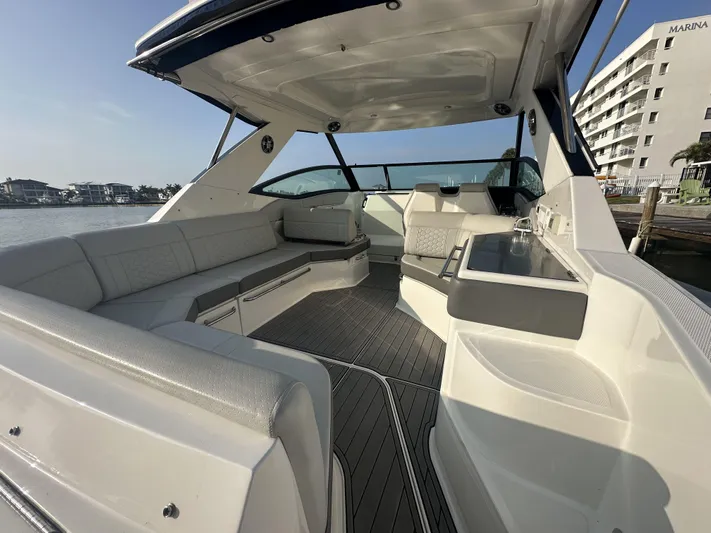  Yacht Photos Pics Luxurious 2021 Sea Ray Sundancer 320 OB boat interior with spacious seating and sleek design.