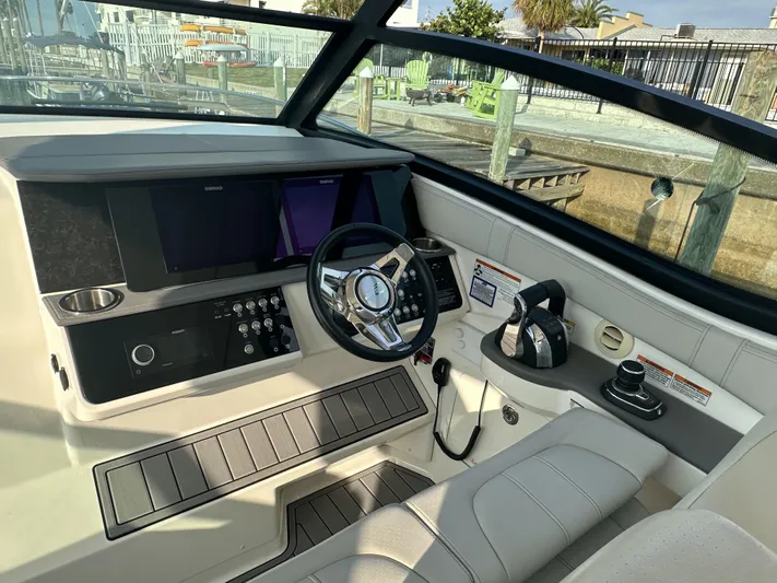  Yacht Photos Pics Cockpit of 2021 Sea Ray Sundancer 320 OB with modern controls and steering wheel.