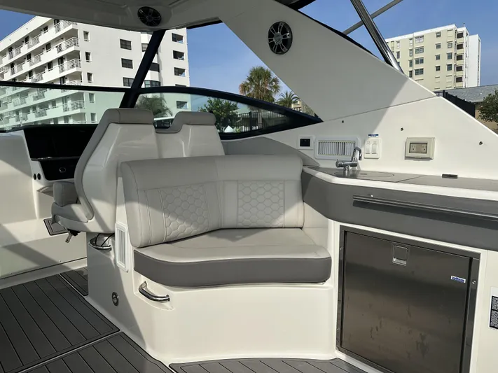  Yacht Photos Pics 2021 Sea Ray Sundancer 320 OB interior with modern seating and sleek design.