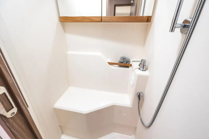  Yacht Photos Pics Modern bathroom in 2022 Hanse 458 yacht with sleek shower design.