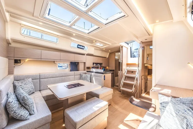  Yacht Photos Pics Luxurious interior of 2022 Hanse 458 yacht with modern seating and ample natural light.