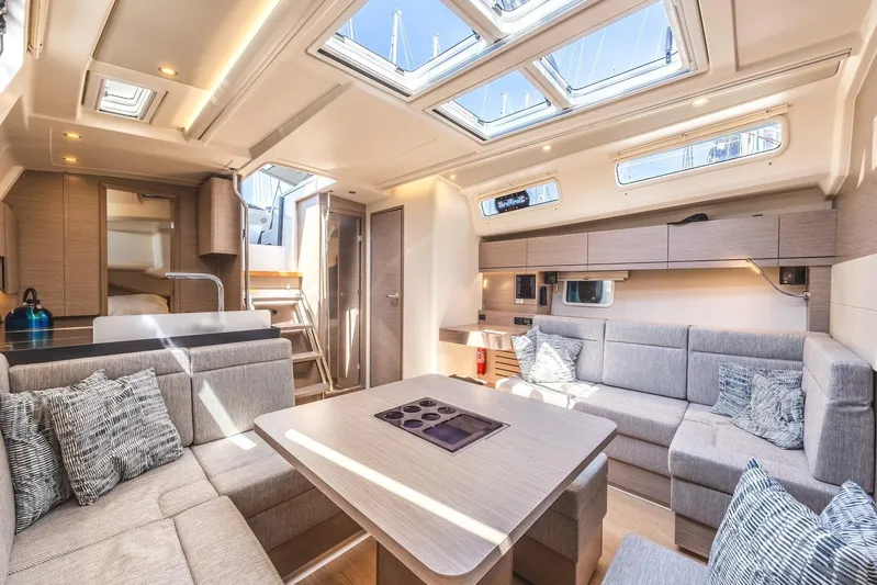  Yacht Photos Pics Luxurious interior of 2022 Hanse 458 yacht with modern furnishings and ample natural light.