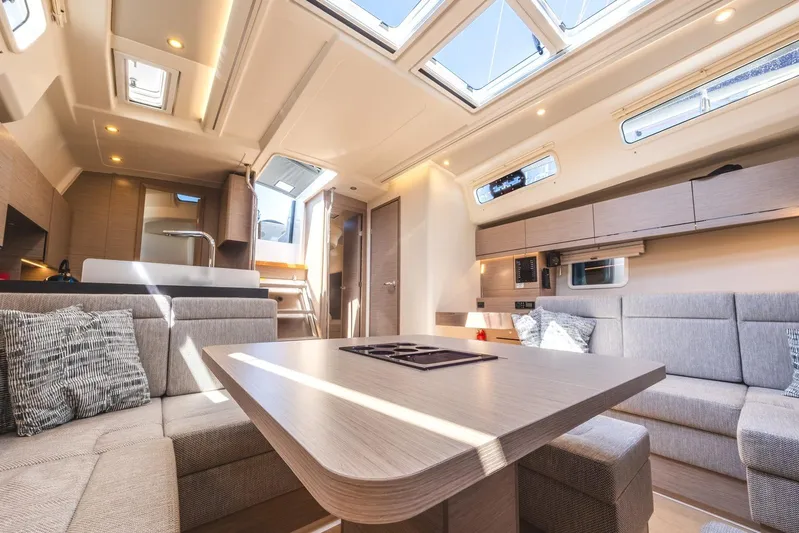  Yacht Photos Pics Luxurious interior of 2022 Hanse 458 yacht with modern furnishings and ample natural light.