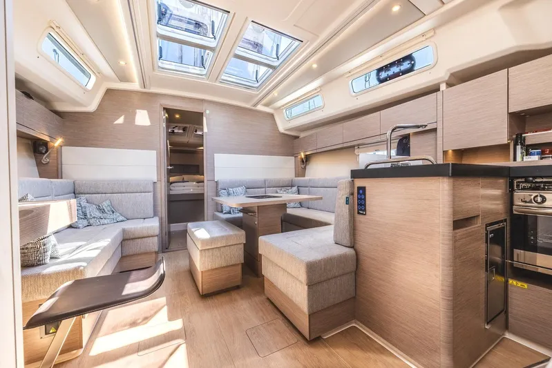  Yacht Photos Pics Luxurious interior of 2022 Hanse 458 yacht with modern design and ample natural light.