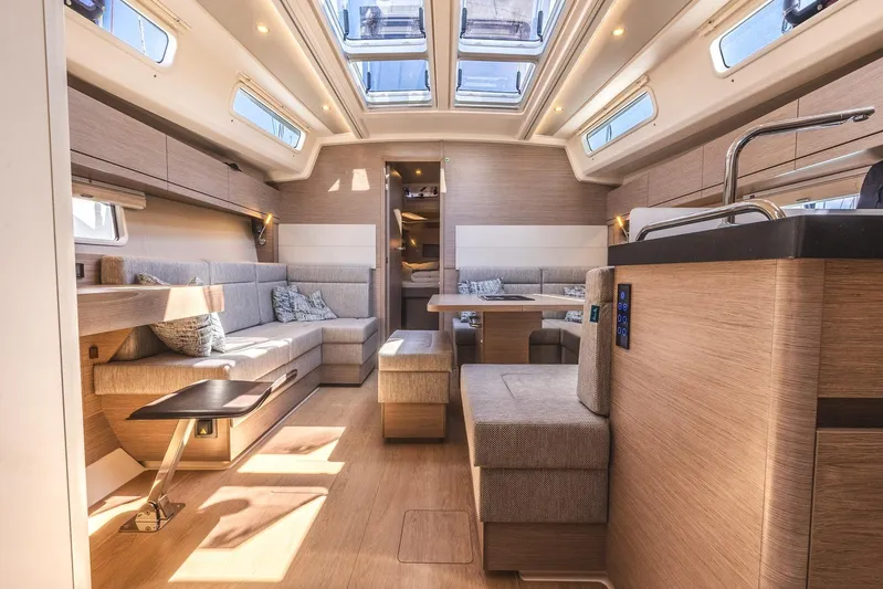  Yacht Photos Pics Luxurious interior of 2022 Hanse 458 yacht with modern furnishings and skylights.