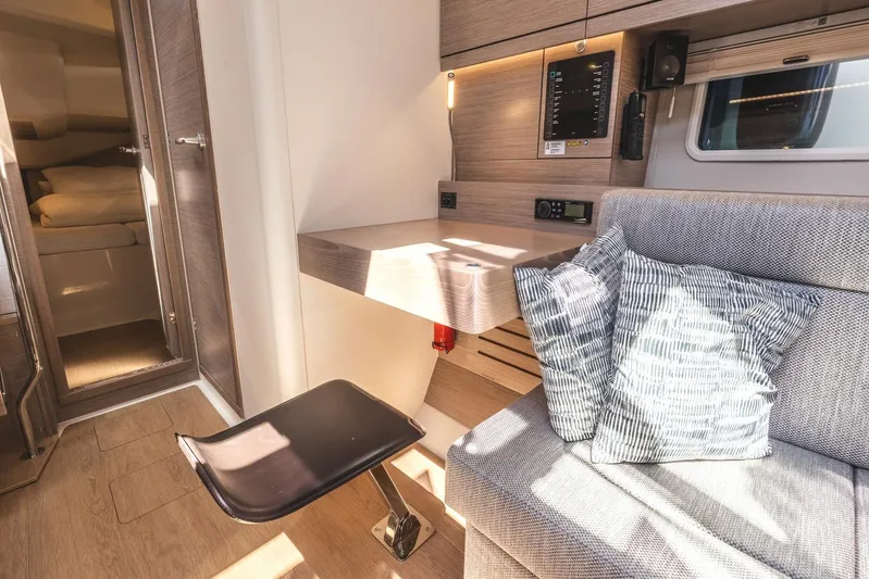  Yacht Photos Pics Interior of 2022 Hanse 458 yacht with modern seating and workspace.