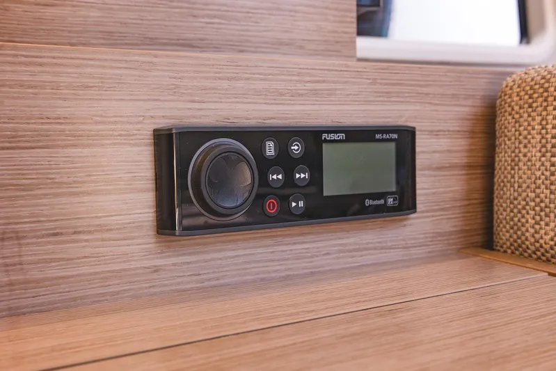  Yacht Photos Pics Control panel on 2022 Hanse 458 yacht interior, featuring Fusion MS-RA70N stereo system.