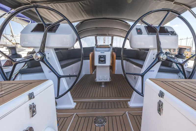  Yacht Photos Pics 2022 Hanse 458 yacht cockpit with dual steering wheels and teak flooring.