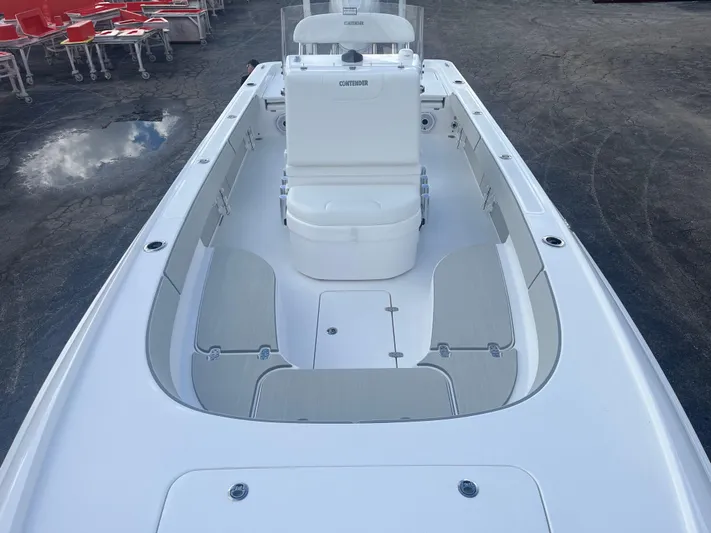  Yacht Photos Pics 2025 Contender 26 Bay boat interior with seating and console, viewed from the bow.