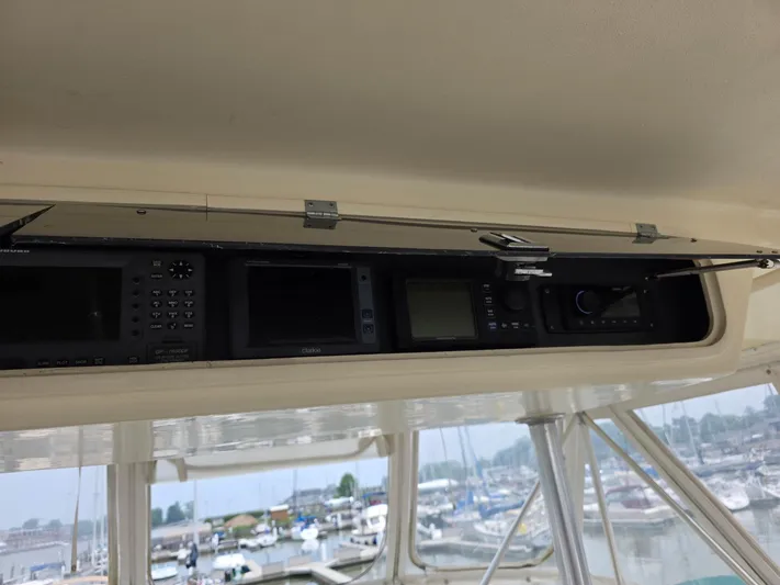 Reel Easy Yacht Photos Pics Control panel of a 1989 Ocean Yachts 55, featuring navigation and communication equipment.