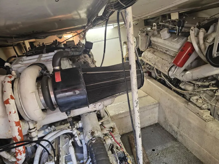 Reel Easy Yacht Photos Pics Engine room of a 1989 Ocean Yachts 55, showcasing dual diesel engines.